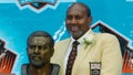 Pro Football Hall of Fame enshrinee Bob Brown poses with his bust during the 2004 NFL Hall of Fame enshrinement ceremony August 8, 2004 in Canton, Ohio.
