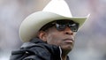 Head coach Deion Sanders of the Colorado Buffaloes watches as his team warms up prior to their spring game at Folsom Field on April 22, 2023 in Boulder, Colorado.