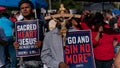 eople listen to a message during a prayer service outside Dodger Stadium, Friday, June 16, 2023, in Los Angeles.