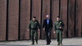 US President Joe Biden speaks with a member of the US Border Patrol as they walk along the US-Mexico border fence in El Paso, Texas, on January 8, 2023. - Biden went to the US-Mexico border on Sunday for the first time since taking office, visiting an El Paso, Texas entry point at the center of debates over illegal immigration and smuggling.