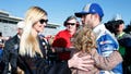 Jimmie Johnson, driver of the #48 Lowe's Chevrolet, celebrates in Victory Lane with his wife, Chandra Janway, and daughter, Lydia, after winning the NASCAR Sprint Cup Series Folds of Honor QuikTrip 500 at Atlanta Motor Speedway on February 28, 2016 in Hampton, Georgia.
