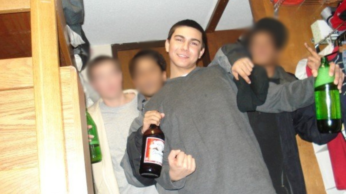 Matthew Nilo posing with friends and alcohol in 2007