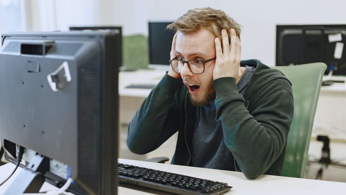 Man shocked on his desk