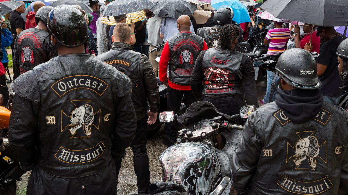 Outcast Motorcycle Club members wearing their biker vests
