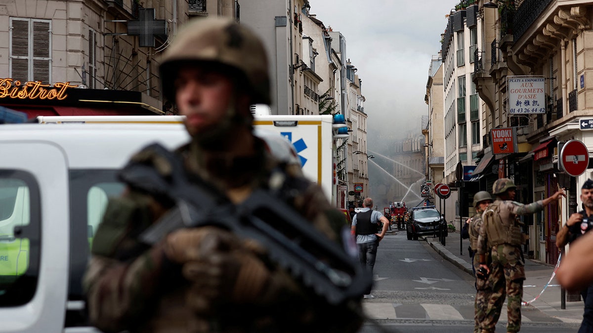 Armed French soldiers stands guard after Paris explosion