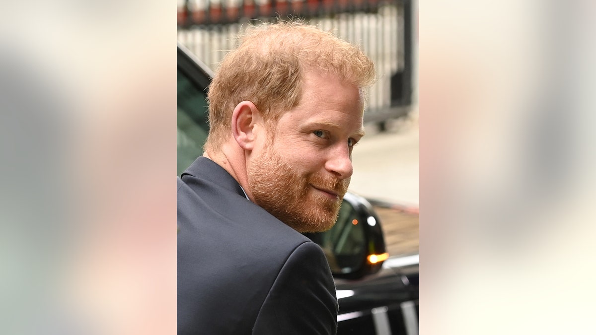 A close-up of Prince Harry coming out of his car