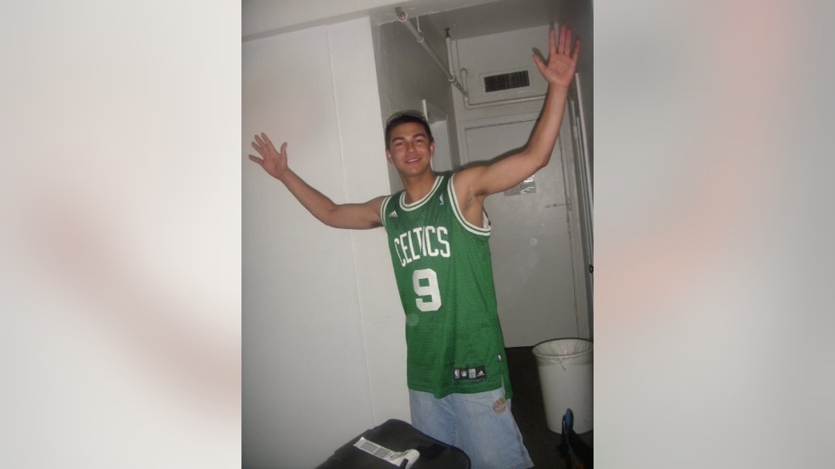 Matthew Nilo wearing a Celtics jersey