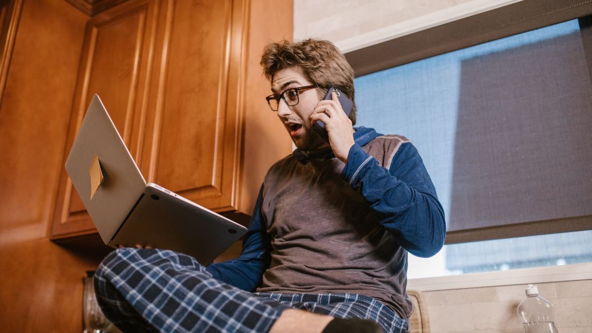 Man shocked on laptop and phone