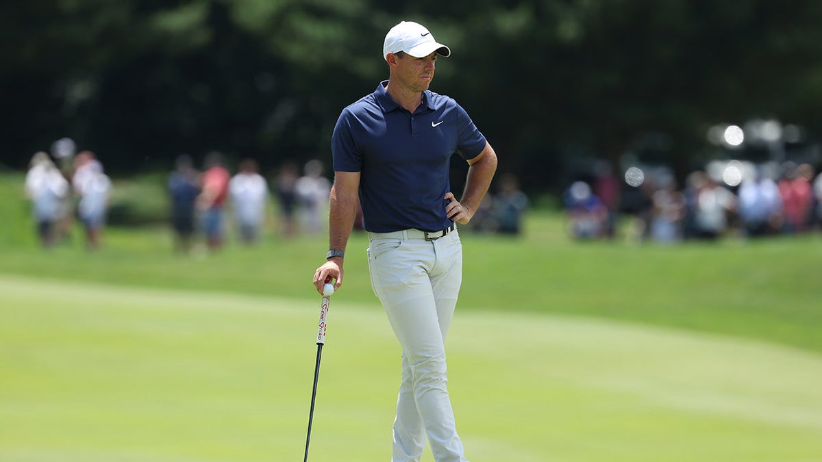 Rory McIlroy stands on green