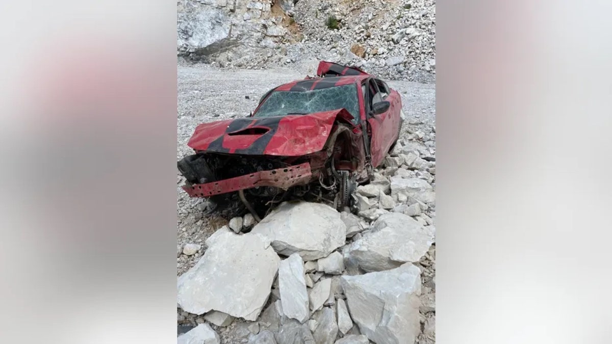 Picture of damaged car in quarry