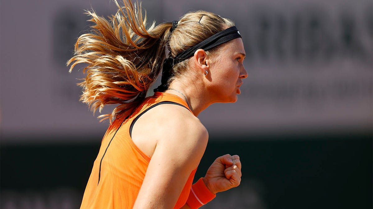 Marie Bouzkova celebrates winning a point