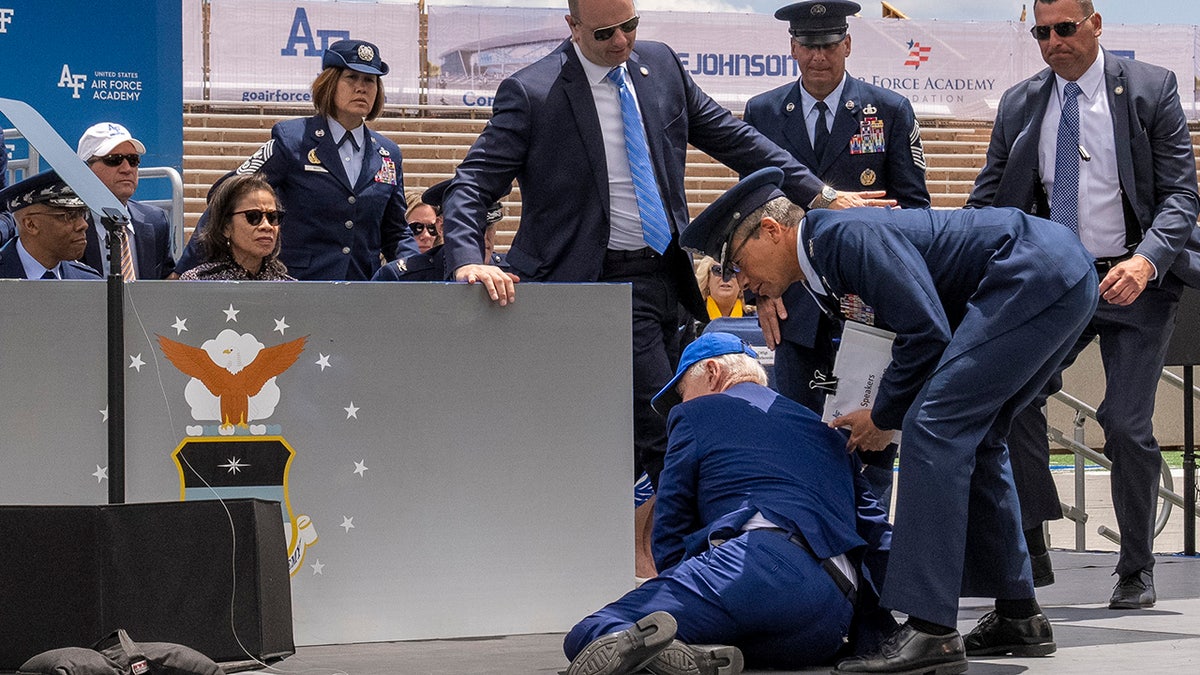 biden trips over sandbag