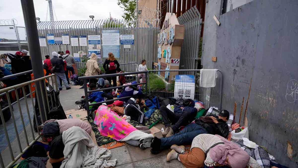 People waiting to apply for asylum camp near the pedestrian entrance to the San Isidro Port of Entry, linking Tijuana, Mexico with San Diego, on June 1, 2023, in Tijuana, Mexico. 