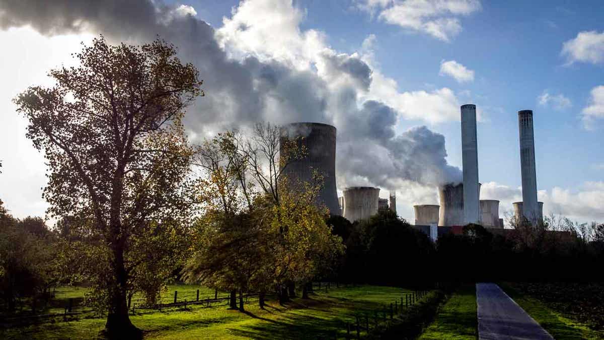  Steam rises from coal-fired power plant