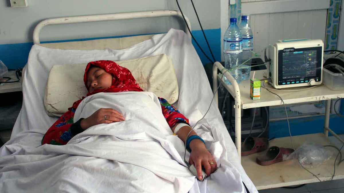 An Afghan schoolgirl receives treatment