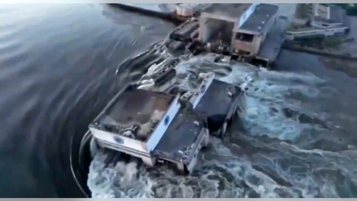 Floodwaters rush through buildings in southern Ukraine