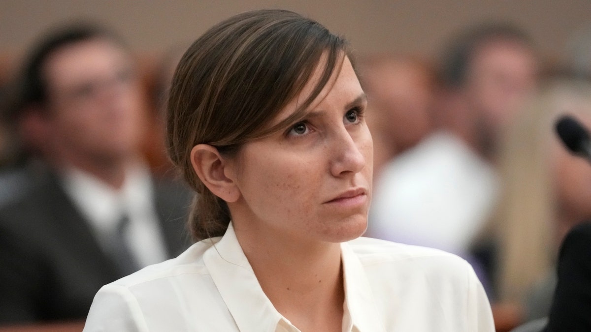 Kouri Richins, Utah mom, in white blouse in court