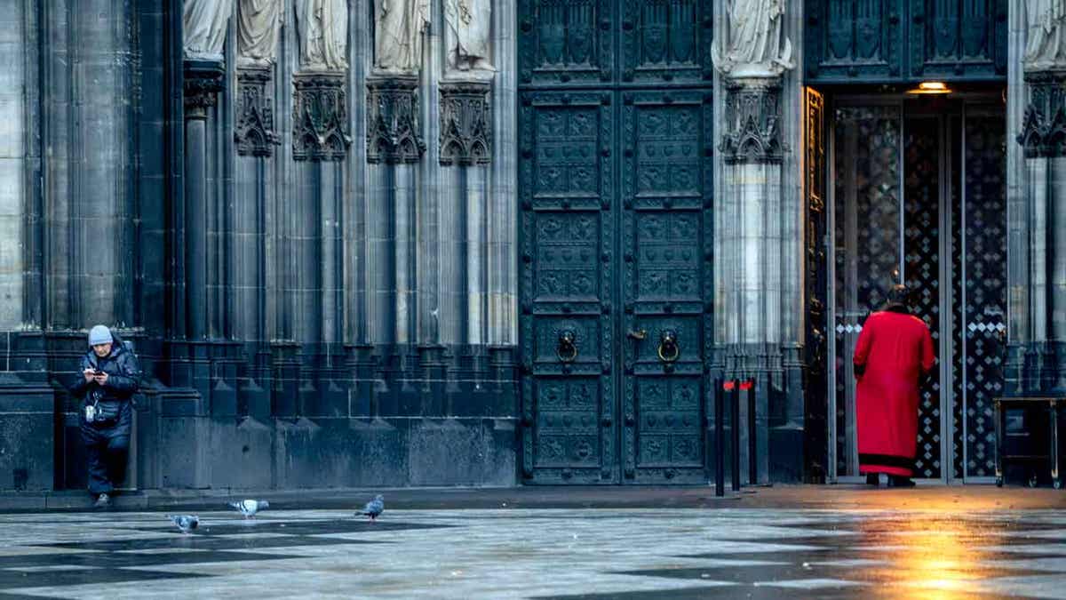 A cathedral door keeper is shown