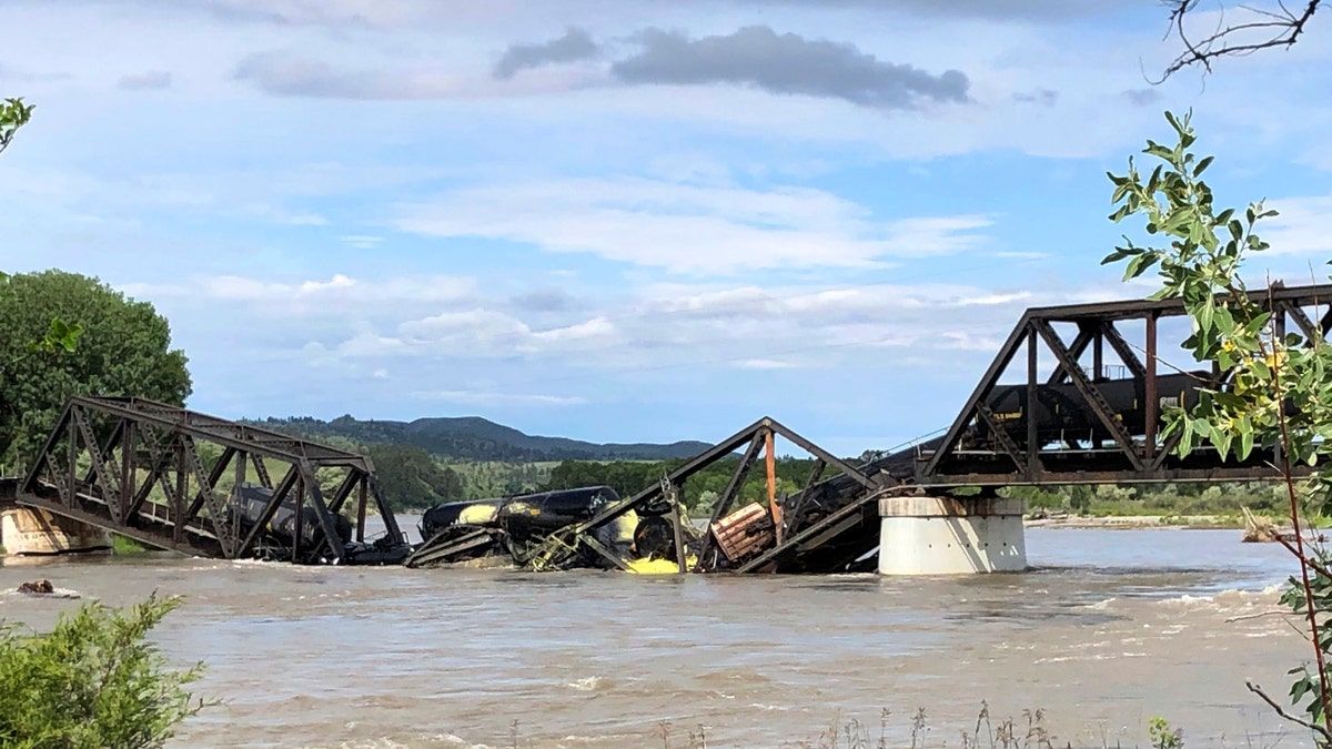 train cars are immersed in the Yellowstone River 