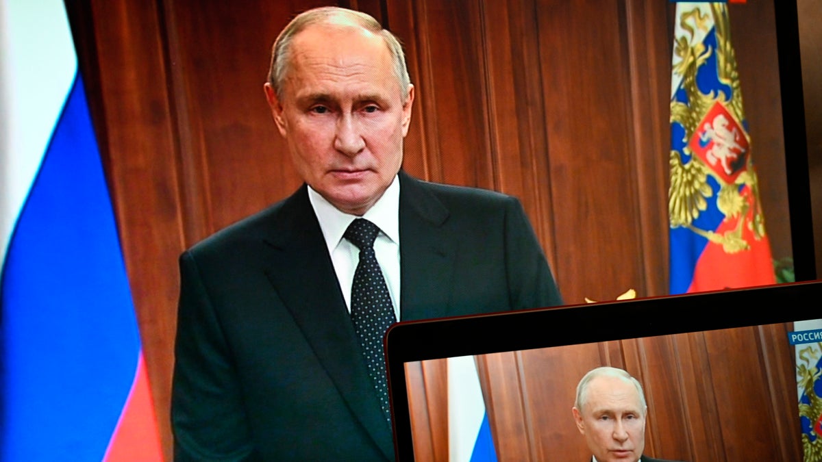 Russian President Vladimir Putin is seen on monitors as he addresses the nation after Yevgeny Prigozhin, the owner of the Wagner Group military company, called for armed rebellion and reached the southern city of Rostov-on-Don with his troops, in Moscow, Russia, Saturday, June 24, 2023. 