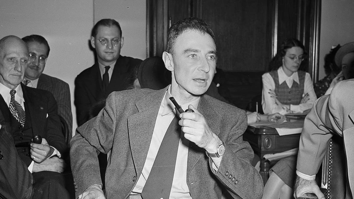 FILE-This Oct. 17, 1945 file photo Dr. J. Robert Oppenheimer of the New Mexico laboratories of the atomic bomb making project, testifies before the Senate Military Affairs Committee in Washington.  The U.S. Department of Energy has declassified documents related to the Cold War hearing on Oppenheimer who directed the Manhattan Project and was later accused of having communist sympathies. The department last week released transcripts of the 1950s hearings on  Oppenheimer's security clearance, providing more insight into the previously secret world that surrounded development of the atomic bomb. (AP Photo,File)
