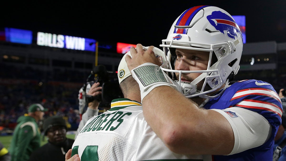 Josh Allen hugs Aaron Rodgers after a game