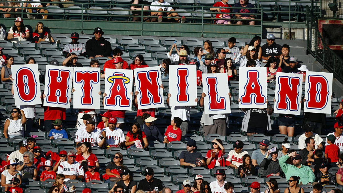 Angels fans hold a Shohei Ohtani sign