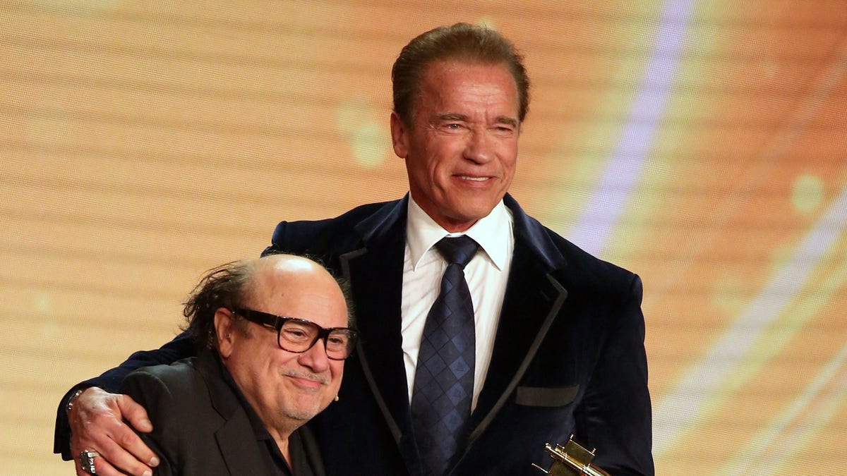 Arnold Schwarzenegger and Danny DeVito on stage together