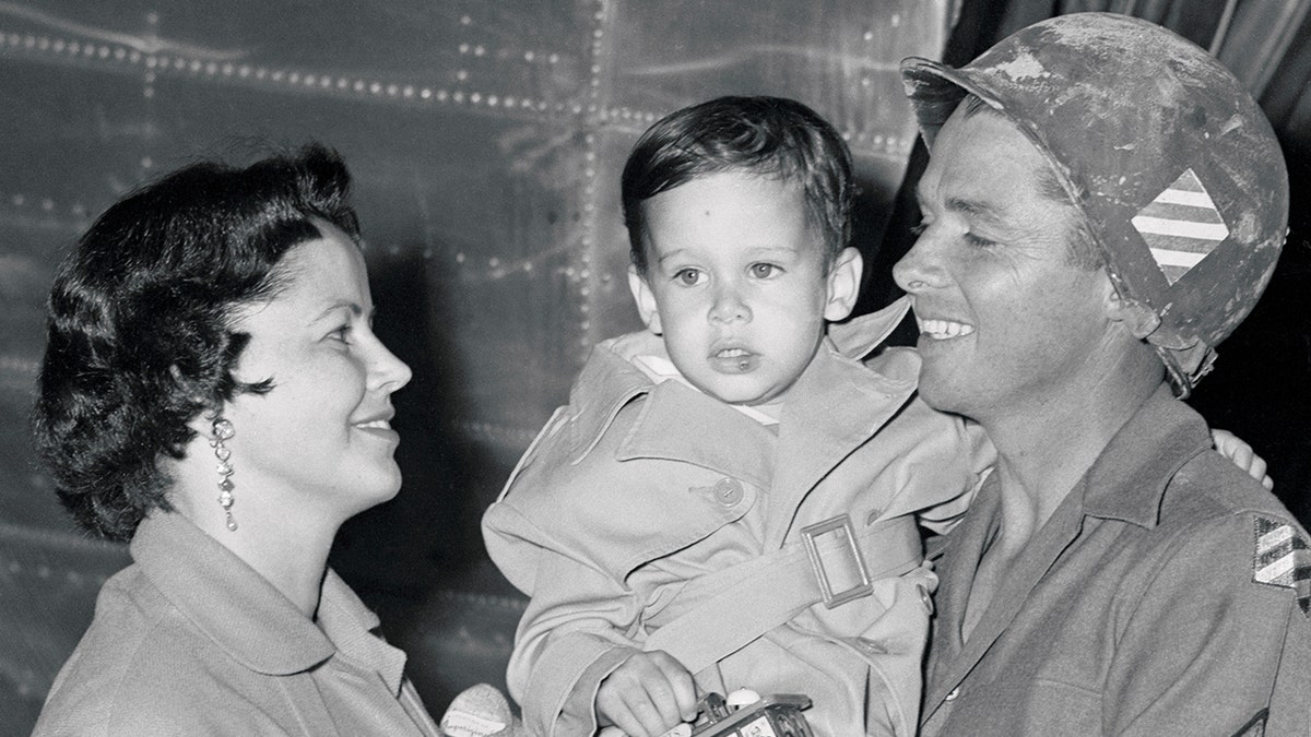 Audie Murphy Holding His Son