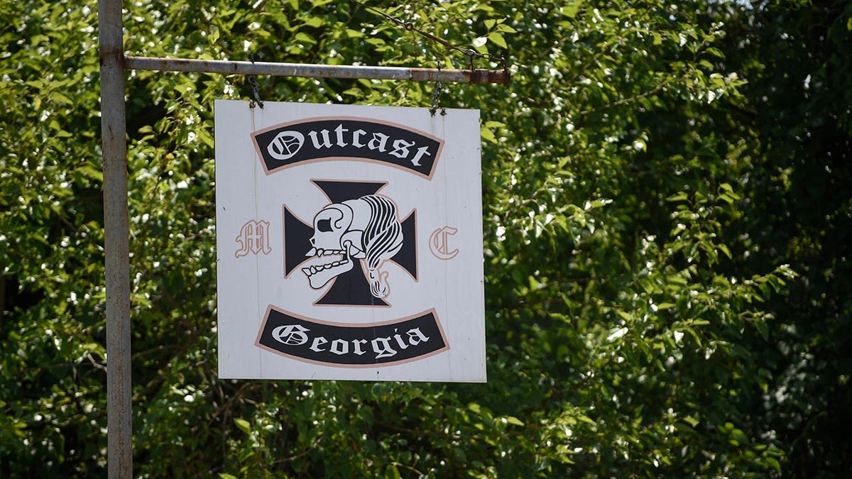 Outcast motorcycle gang clubhouse sign