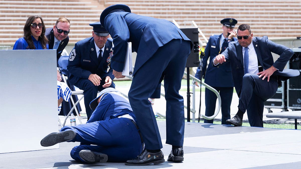 Biden falls during graduation