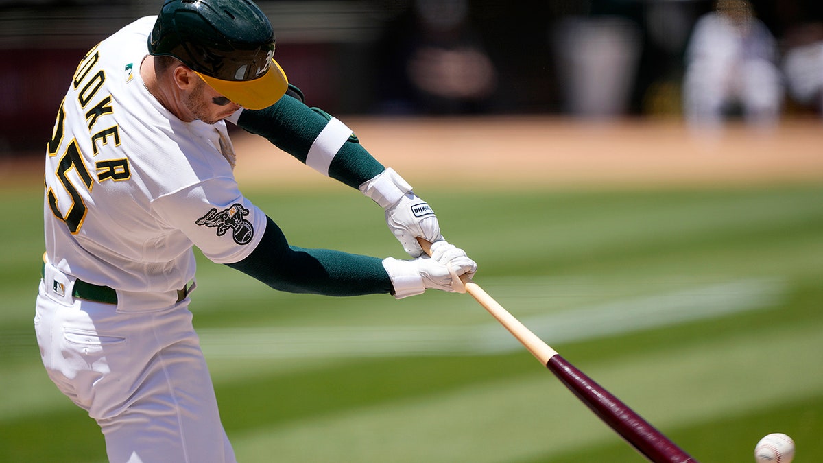 Brent Rooker swings