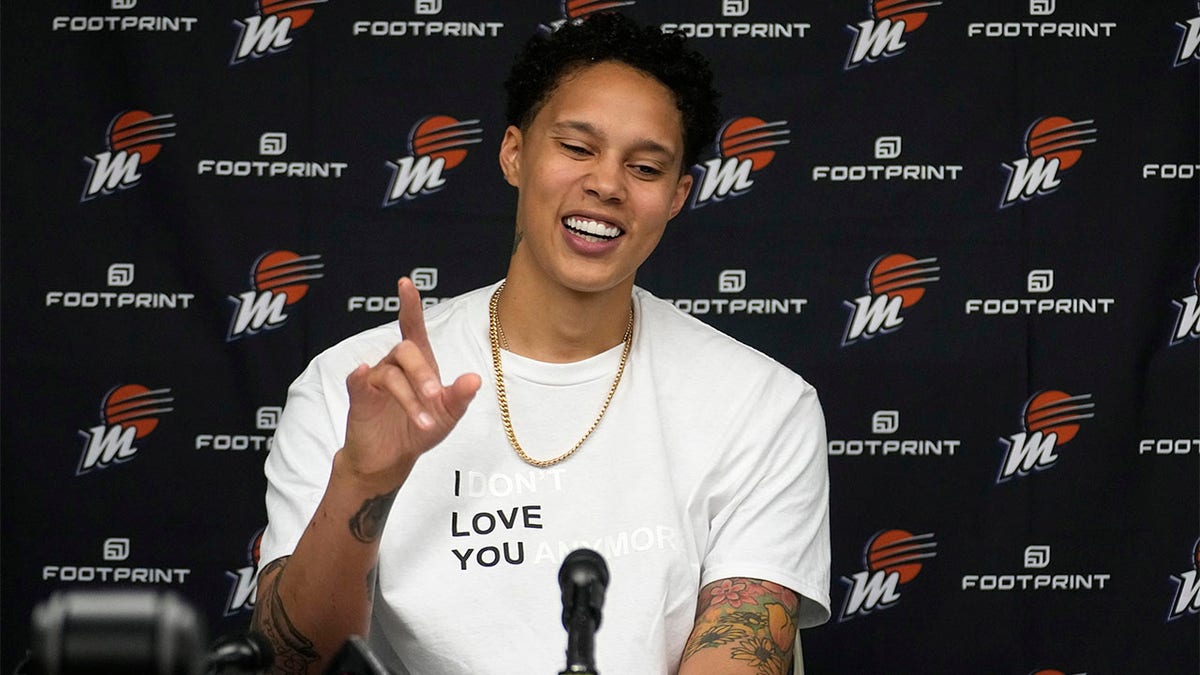 Brittney Griner smiles at a press conference