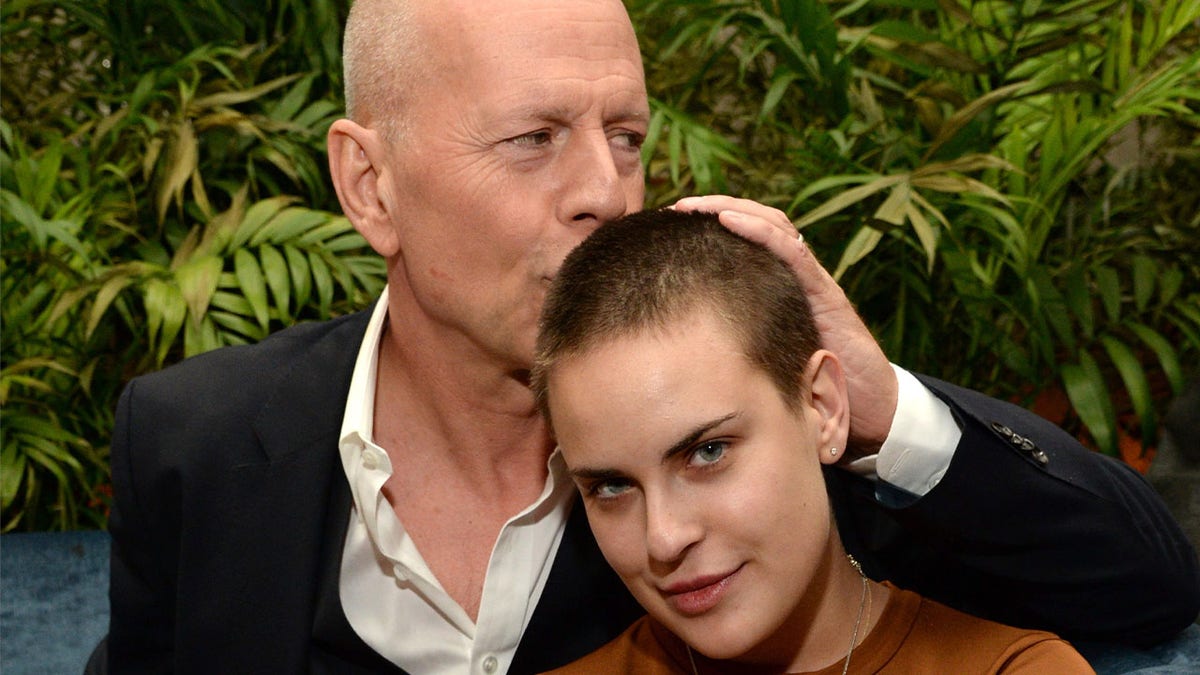 Bruce Willis kisses daughter Tallulah Willis on the head