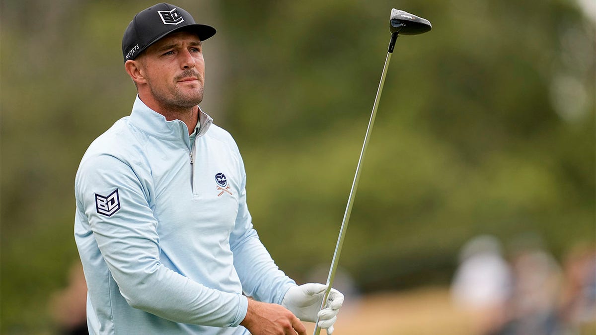 Bryson DeChambeau watches tee shot