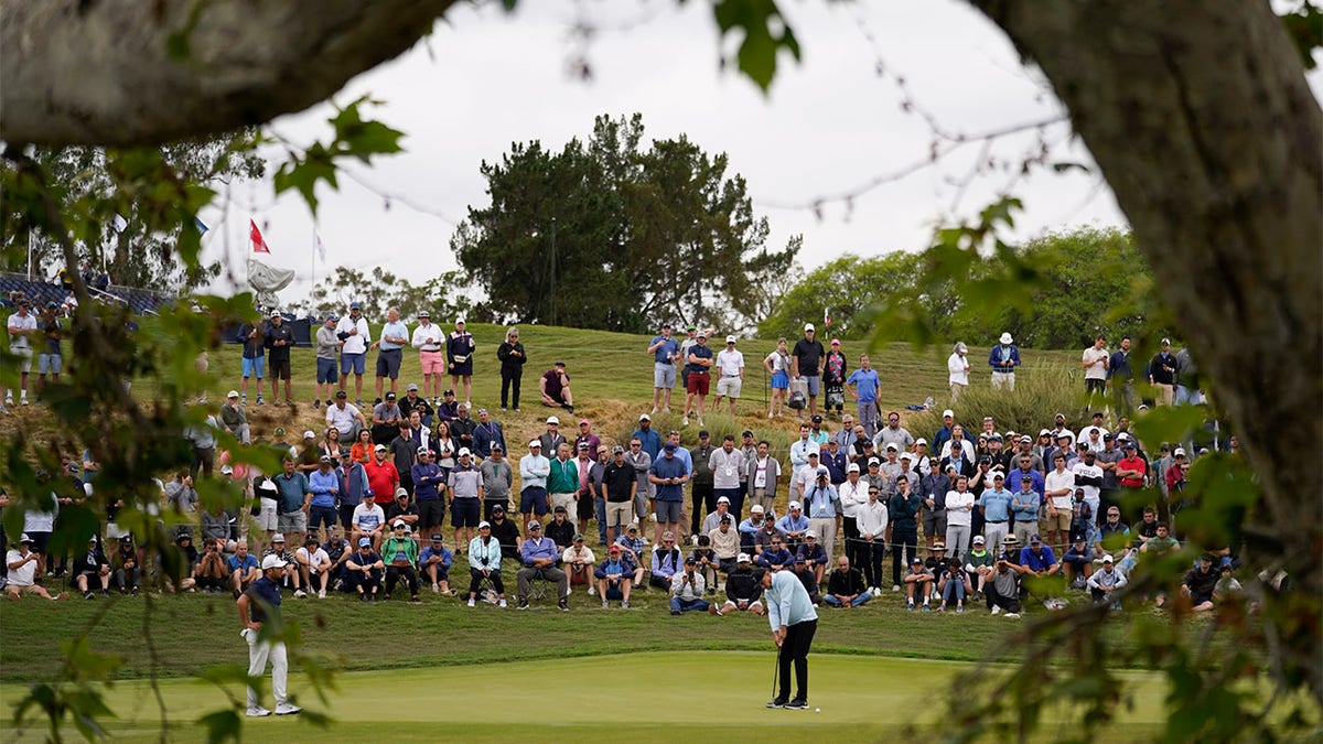 Bryson DeChambeau hits putt