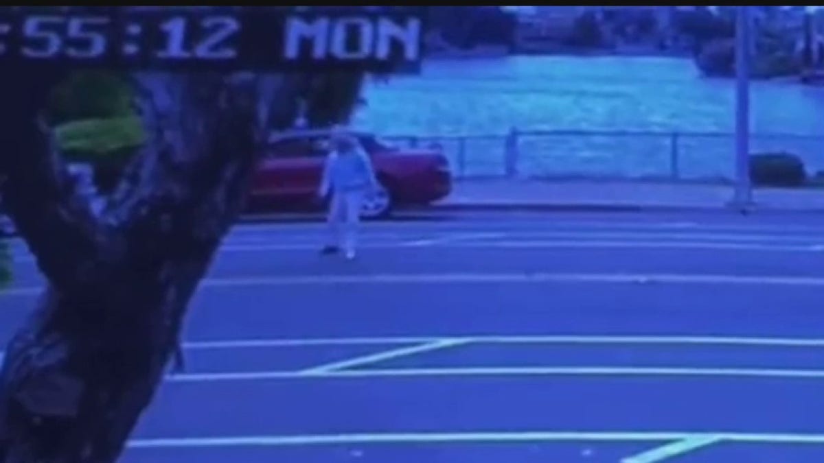 woman standing up in street