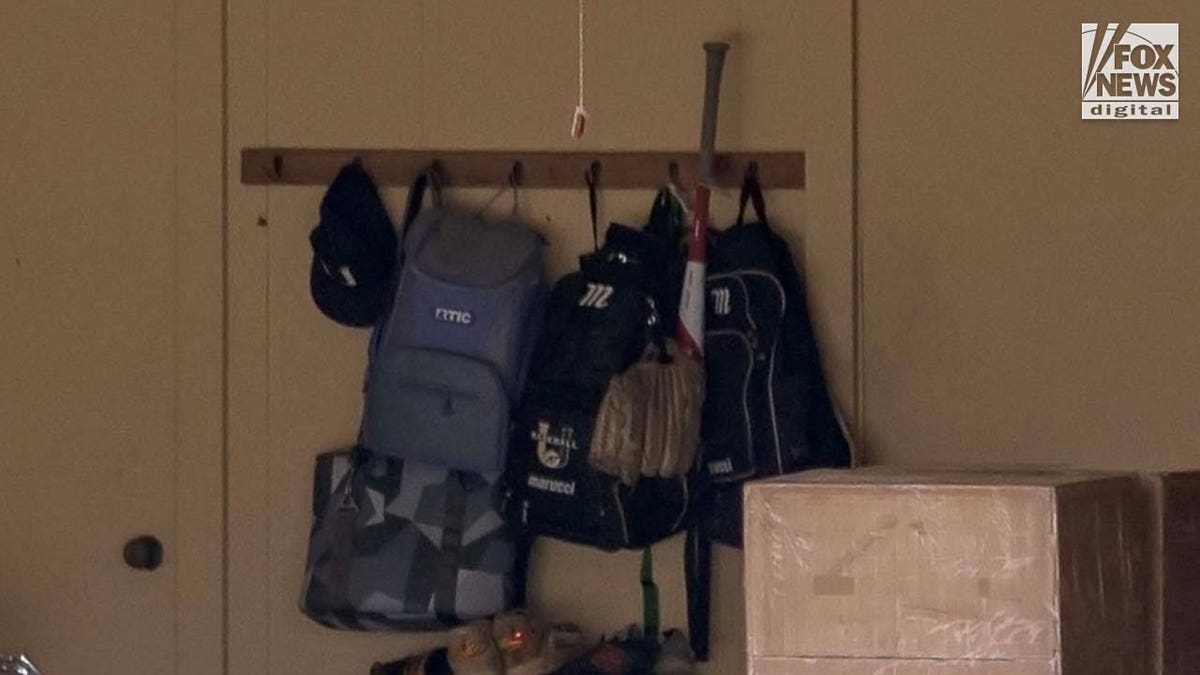 bag holding baseball equipment hangs outside the home of Cameron Robbins in Baton Rouge, Louisiana