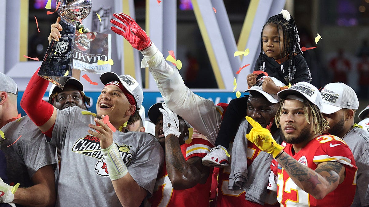 Patrick Mahomes holds trophy