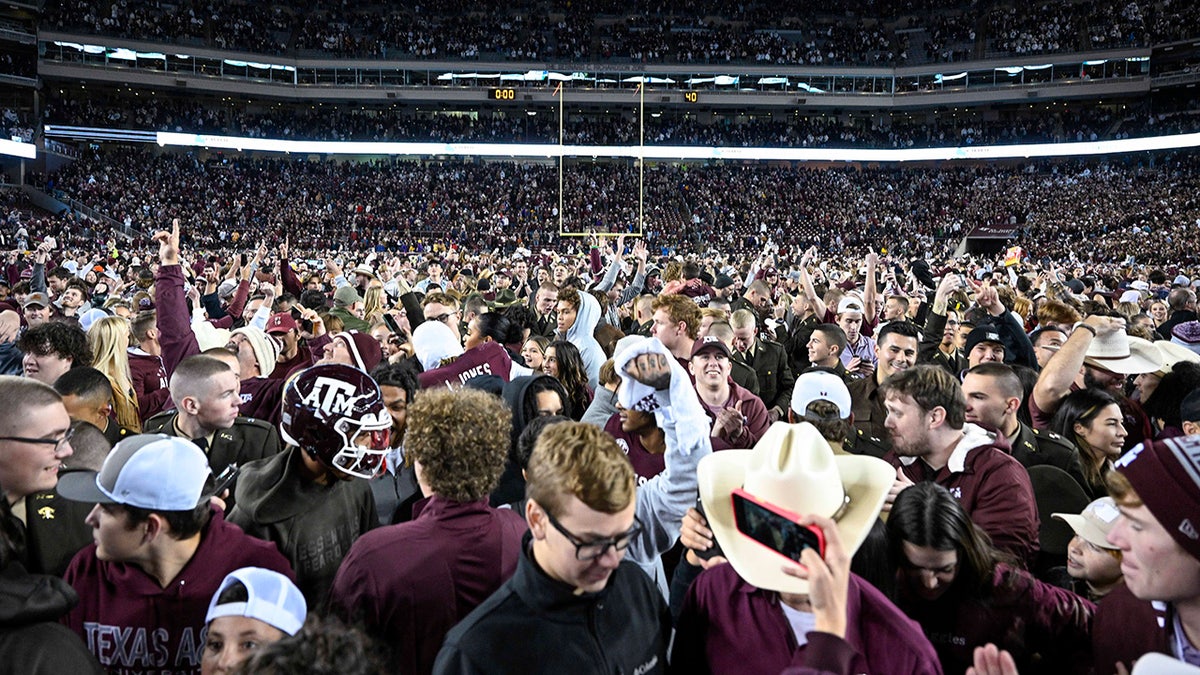 Fans and students as they rush the field