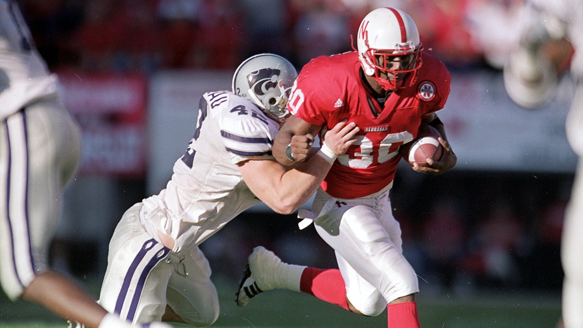 Dahrran Diedrick carries the ball during a football game