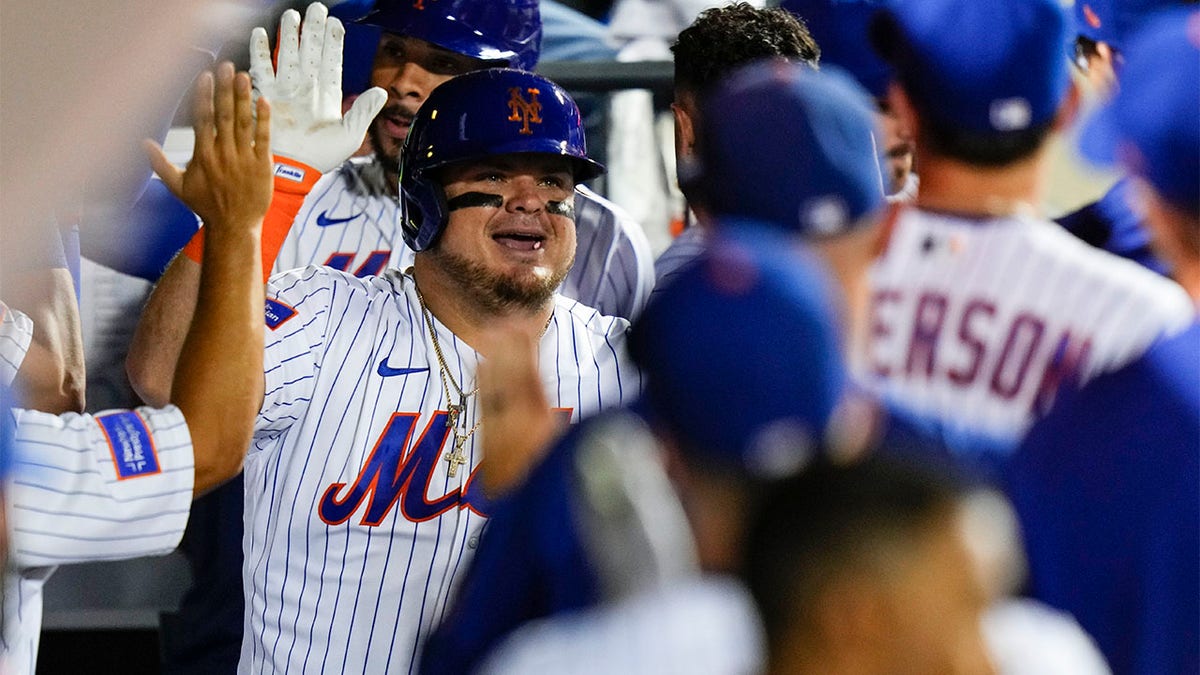 Daniel Vogelbach celebrates with teammates