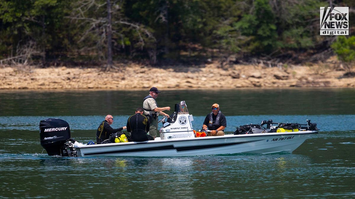 Benton County Sheriff divers search Beaver Lake in Rogers, Arkansas, Friday, June 2, 2023.