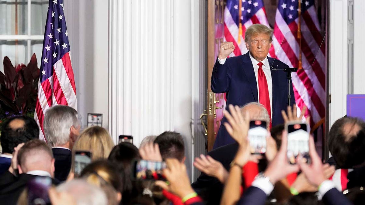 Donald Trump motions after speaking to supporters at Trump National Golf Club Bedminster