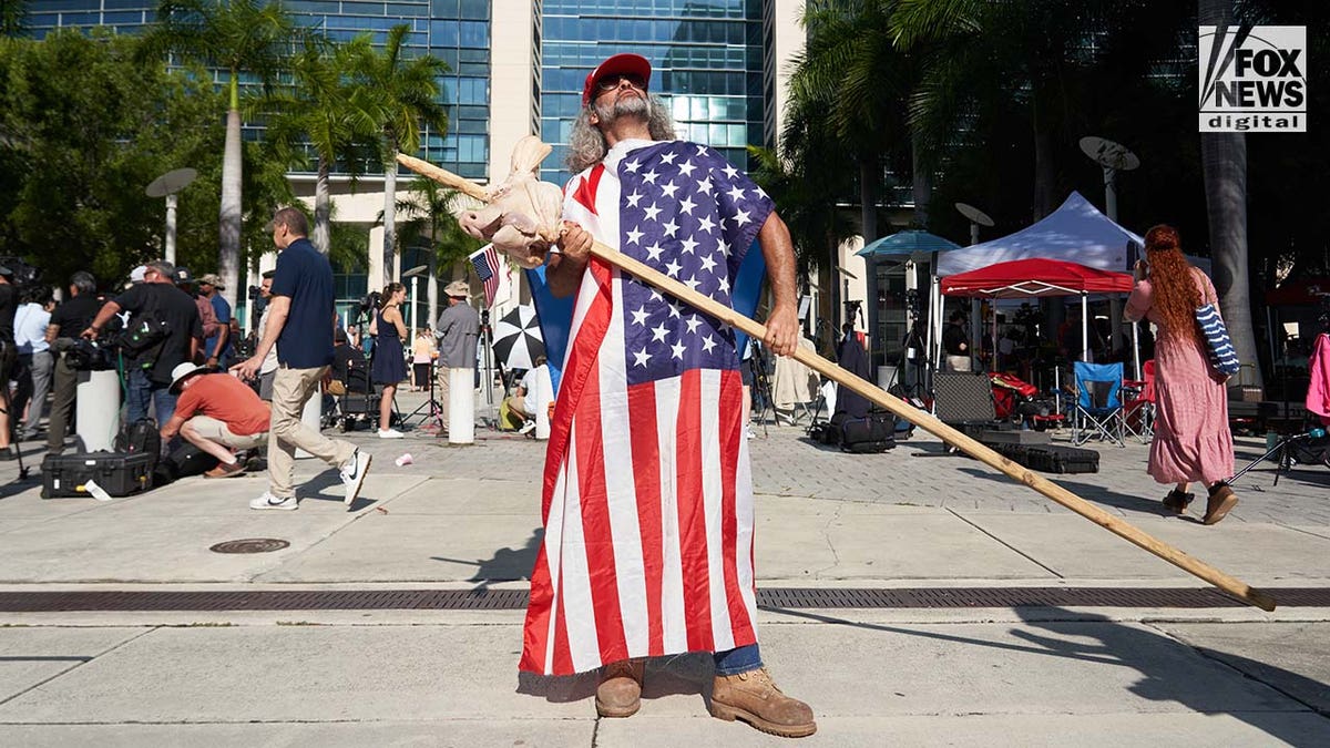 Demonstrators rally outside of a Miami Federal Courthouse ahead of Donald Trump's arraignment