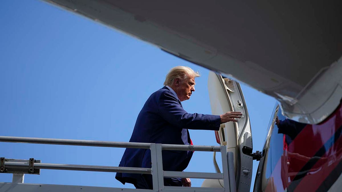 Donald Trump boards his personal plane