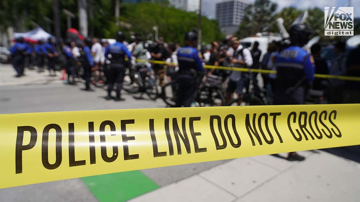 City of Miami Police move media behind police tape