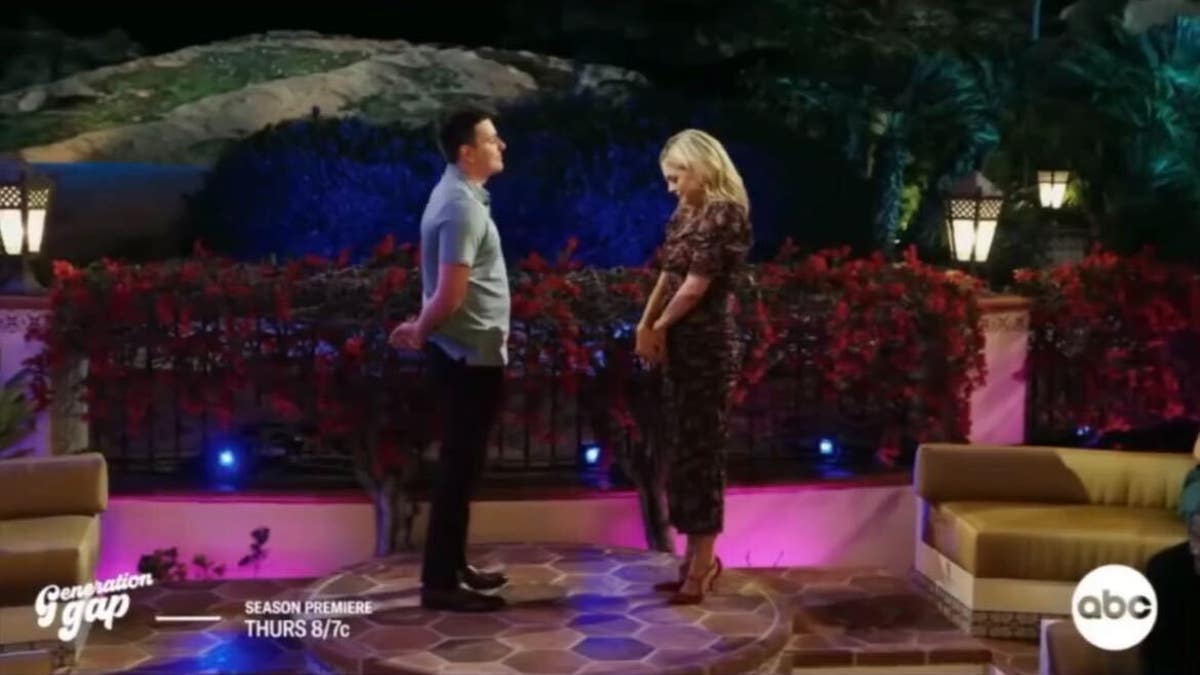 carly reeves standing with contestant hugo