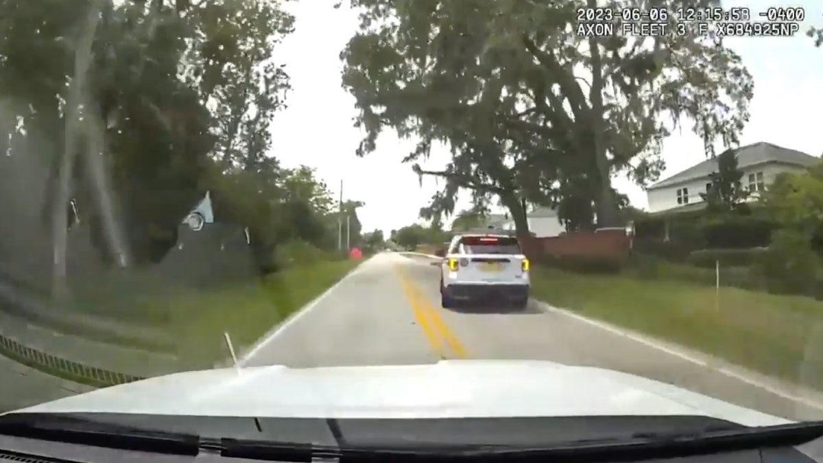 city cop pulled over, car shown via dash cam still