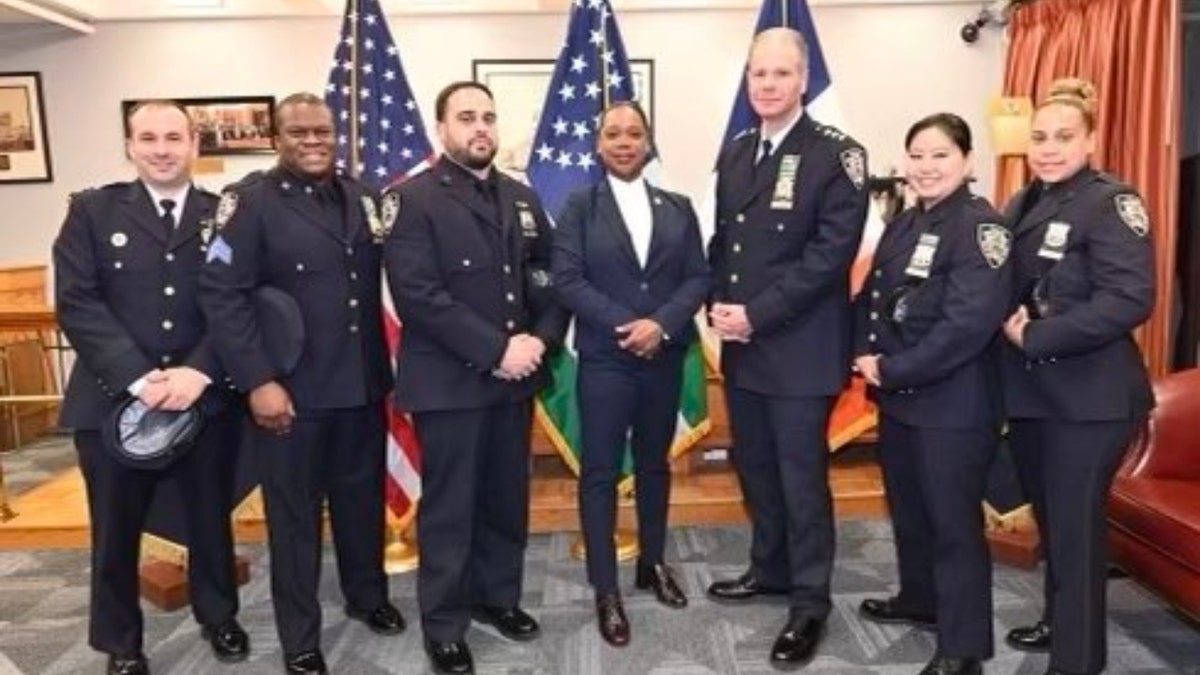 Clyde Jasmin, Ivan Nunez, Bonnie Wong and Jazmin Roman, along with their commanding officer, Billy Haut; NYPD Chief Michael Kemper; and Commissioner Keechant L. Sewell